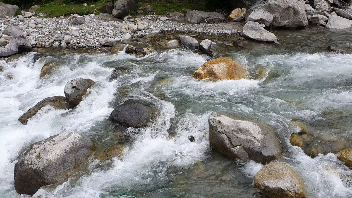 Video Of Shallow River Flowing Through Be Of Rocks Free Stock Video ...
