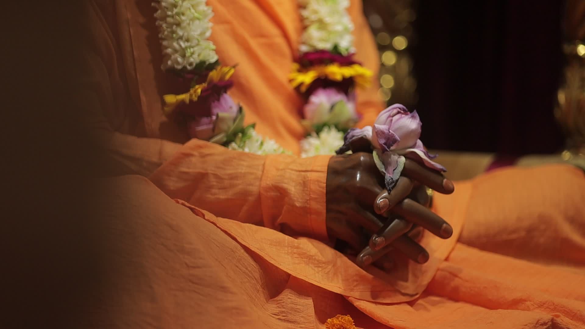 A man in orange robes sitting on a chair Free Stock Video Footage ...