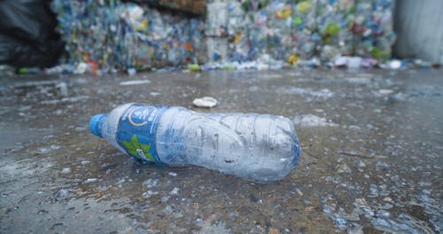 An Empty Plastic Bottle Lying On The Floor