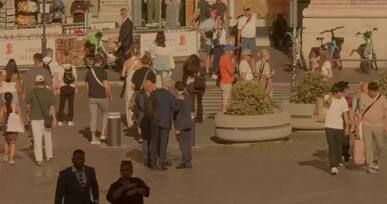 bustling plaza in rome with engaged tourists