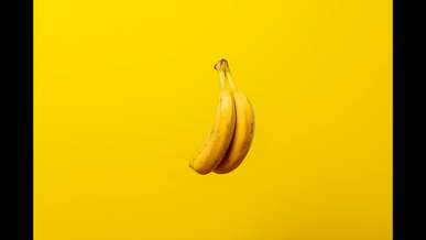 a ripe yellow banana fruits in motion