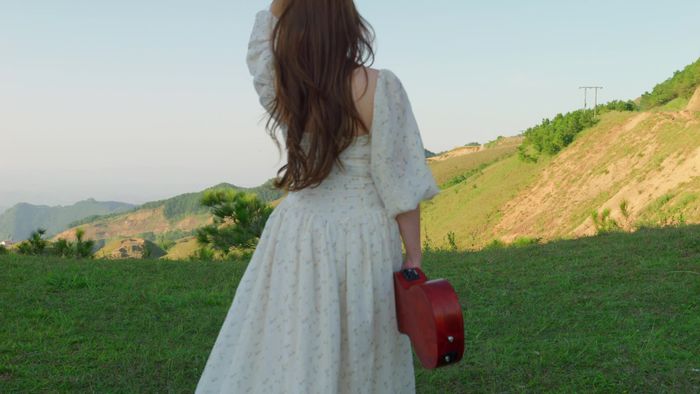White dress on a scenic hillside
