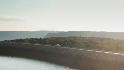 A Road Built On Top Of A Dam Wall