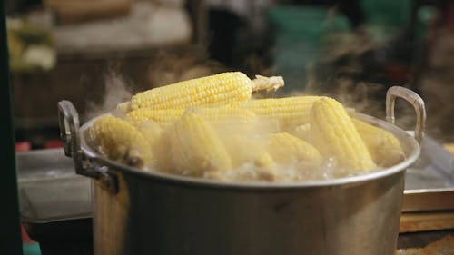 Cooking Corm Cobs In A Boiling Water