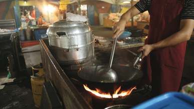 cooking fried rice in a wok