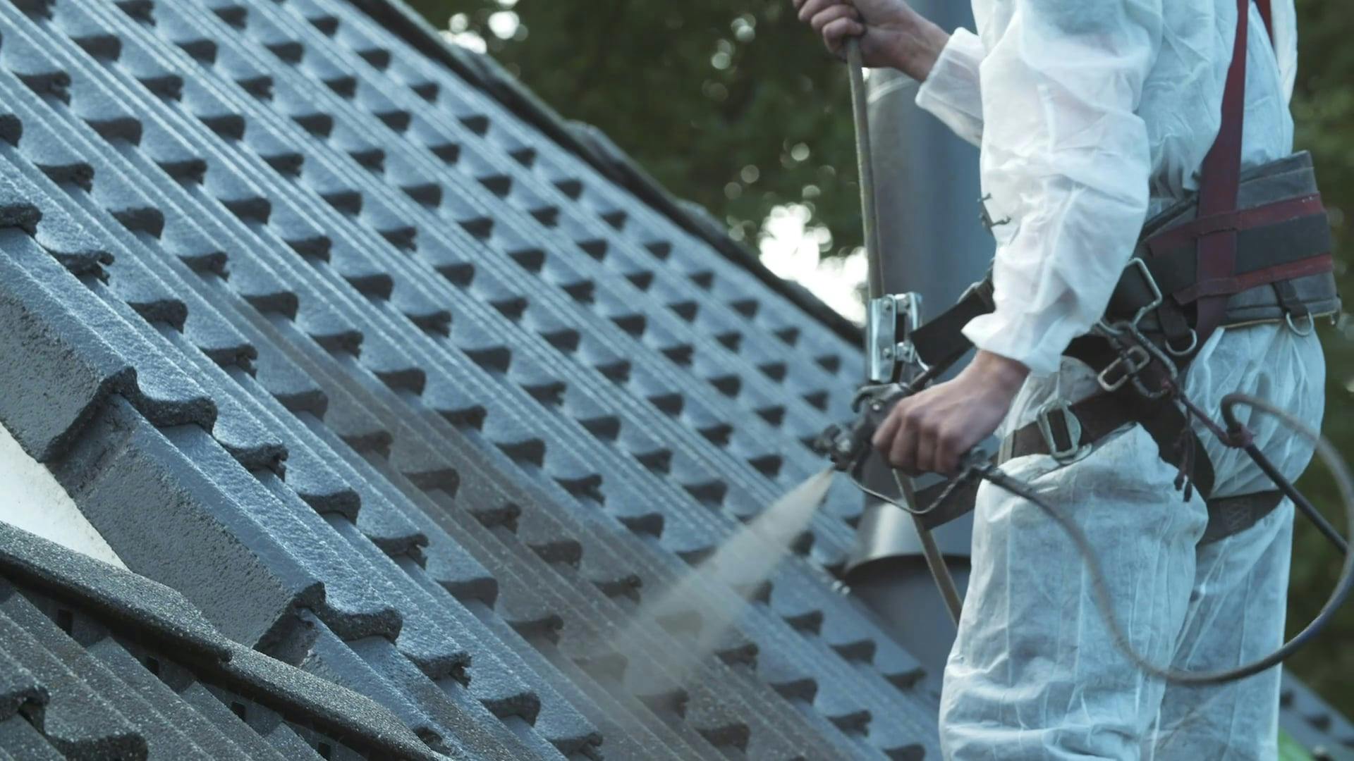 Coating A Concrete Roof With Spray Paint · Free Stock Video
