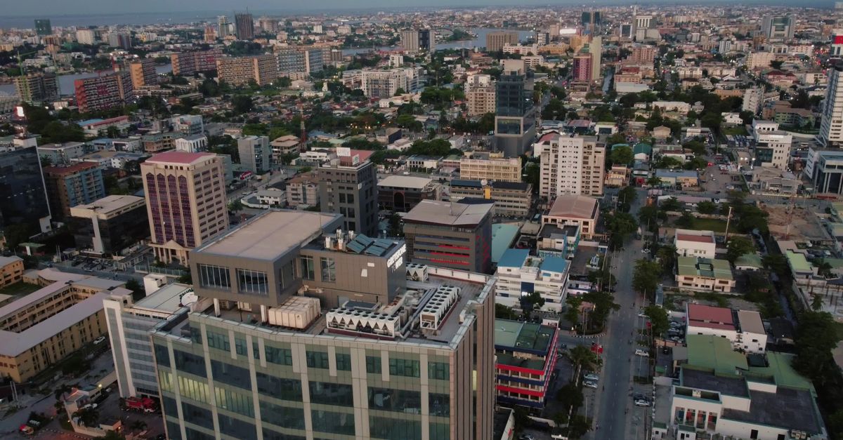 Aerial View Of Lagos City Skyline At Sunset Free Stock Video Footage aerial-view-of-lagos-city-skyline-at-sunset-free-stock-video-footage