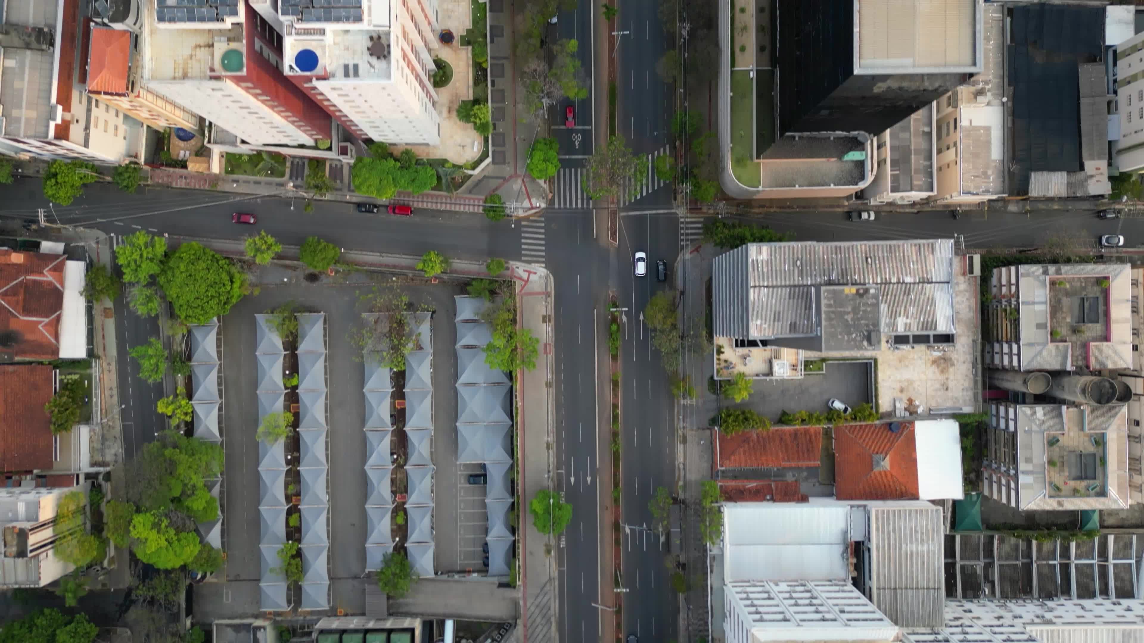 An aerial view of a city street with cars and buildings Free Stock ...
