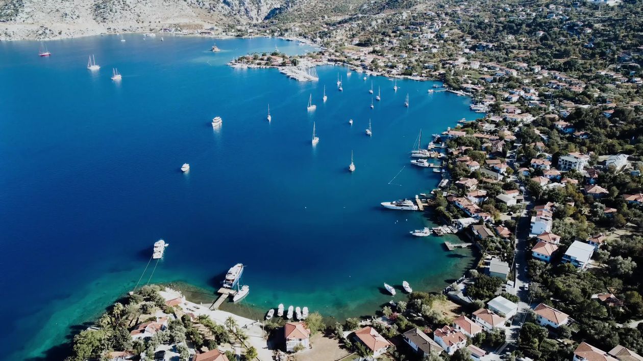 Aerial View of Coastal Town with Boats in Harbor Free Stock Video ...