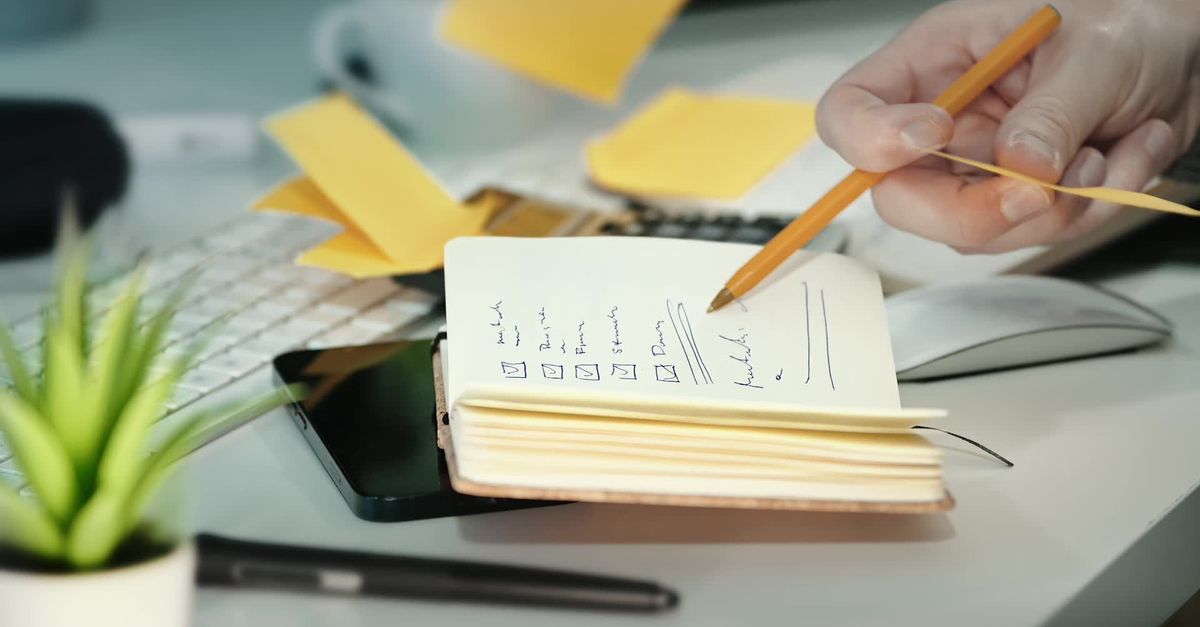 Setting Up Notes Organizing Tasks with Sticky Notes in Office Setting Free Stock Video ...