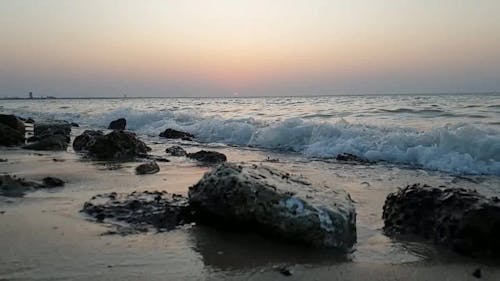 Waves Crashing To The Rocks Along The Seashore