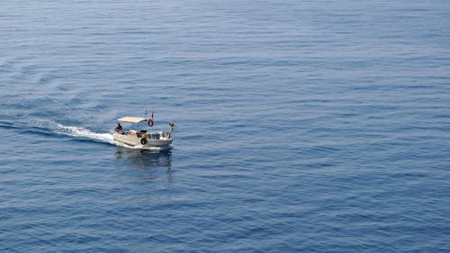 A Fishing Boat Out In The Sea