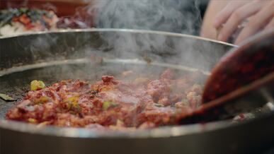 sizzling korean stir fry in hot pan
