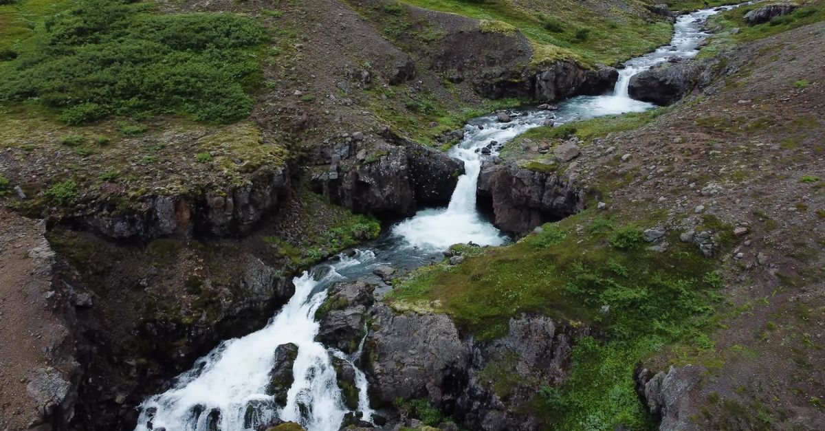 Aerial View of Scenic Waterfall Stream Over Rocks Free Stock Video ...
