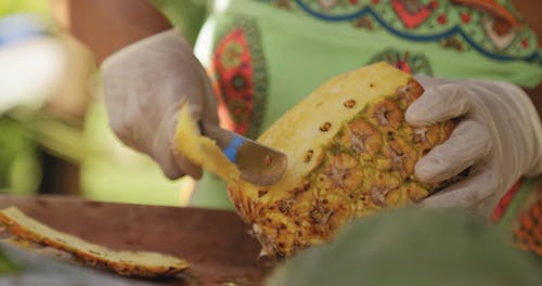 Peeling A Pineapple With Knife