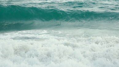calming ocean waves crashing on shore