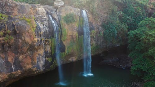 Water Falls Off  A Rocky Mountain Cliff