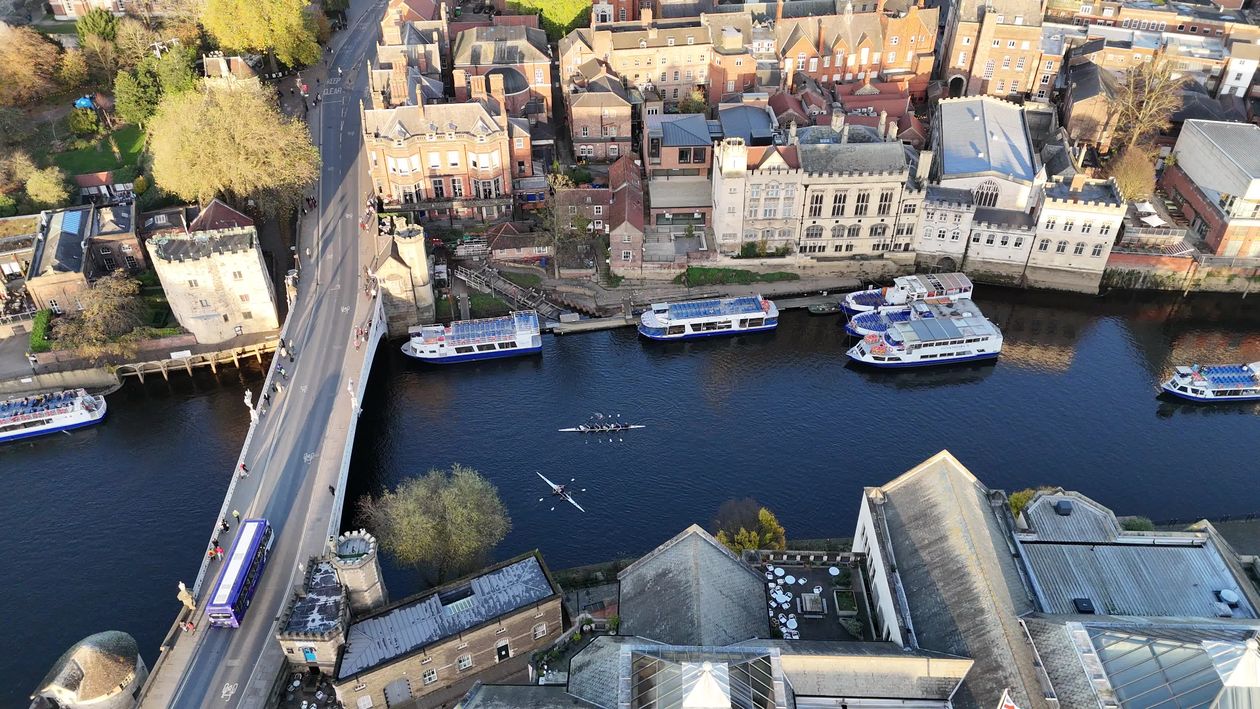 Aerial View of River with Boats and City Buildings Free Stock Video ...