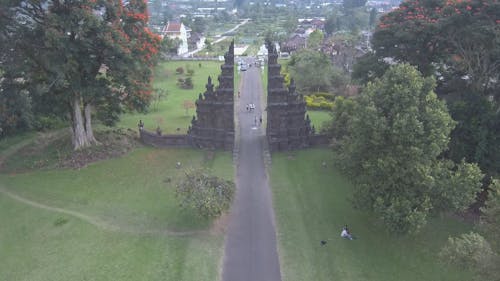 People On The Road Entering A Park