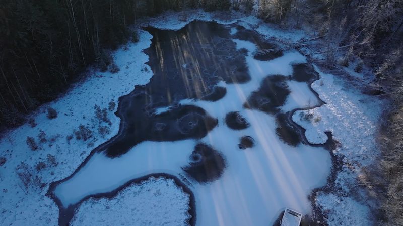 Aerial View of Snow-Covered Frozen Lake in Winter Free Stock Video ...