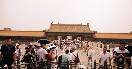 A Crowd Of Tourist Visiting An Ancient Temple Ground