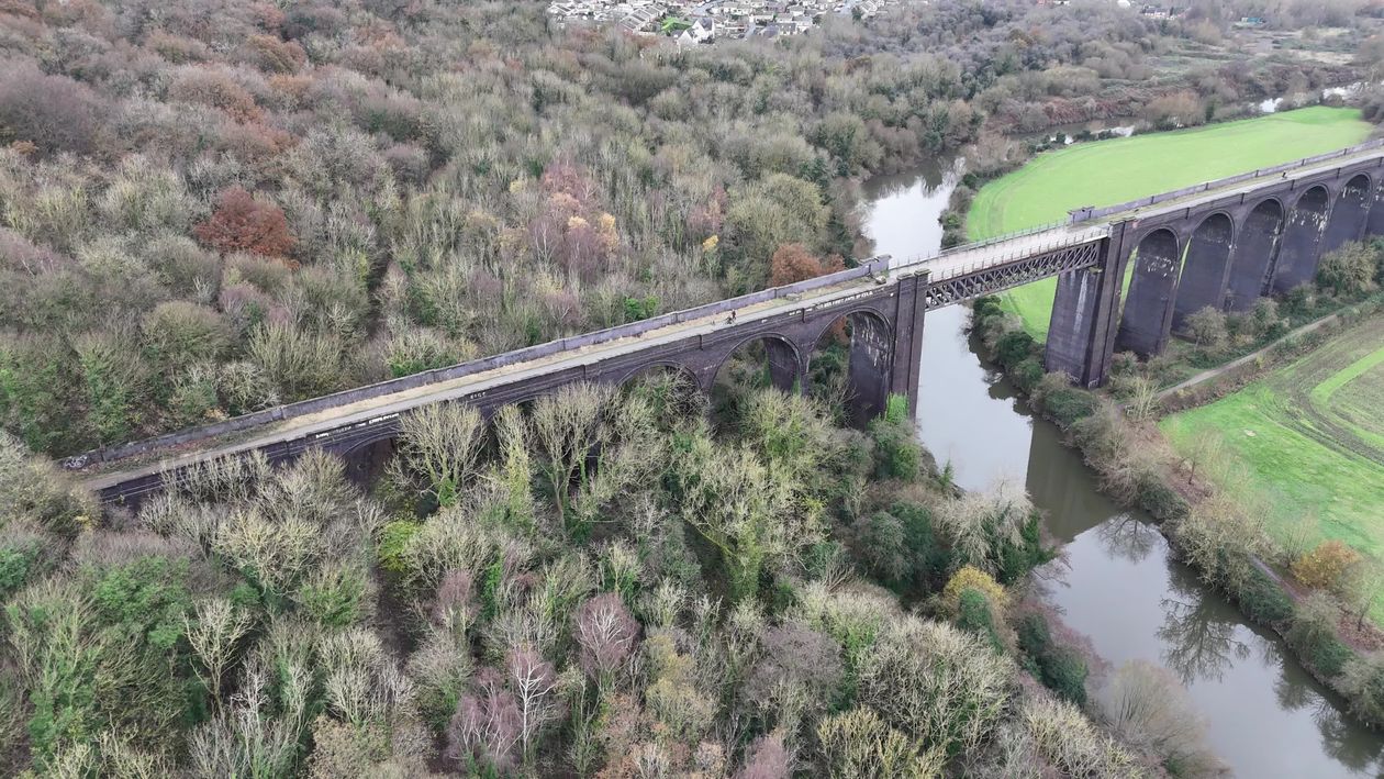 Scenic Aerial View of Viaduct Over a Lush Forest Free Stock Video ...