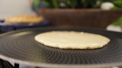 Flipping A Pancake On A Hot Non-stick Pan