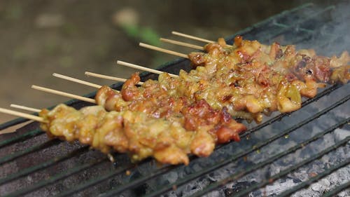 Cooking Barbecue On Stick In A Charcoal Grill