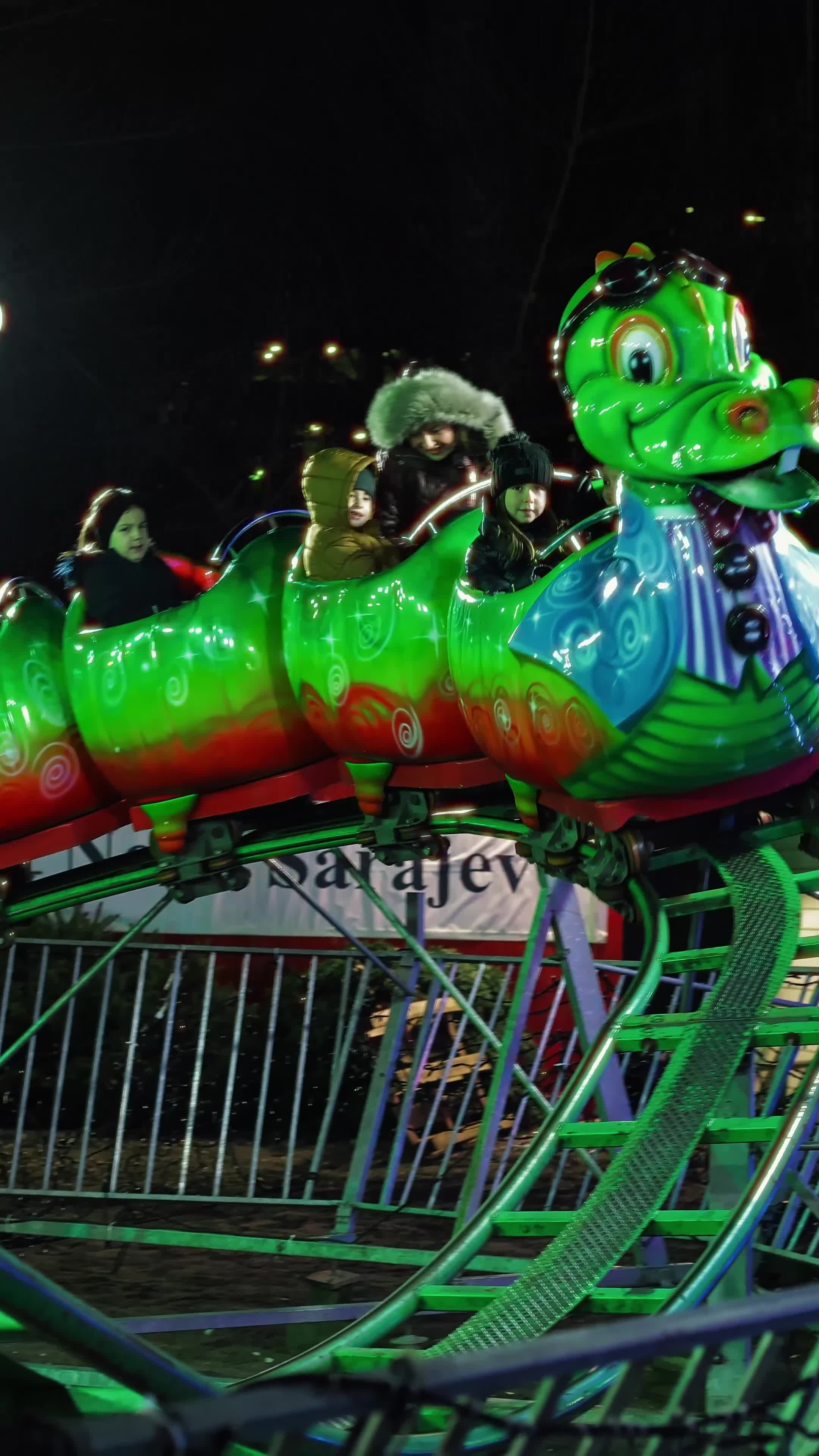 Nighttime Carnival Ride with Dragon Rollercoaster Free Stock Video ...