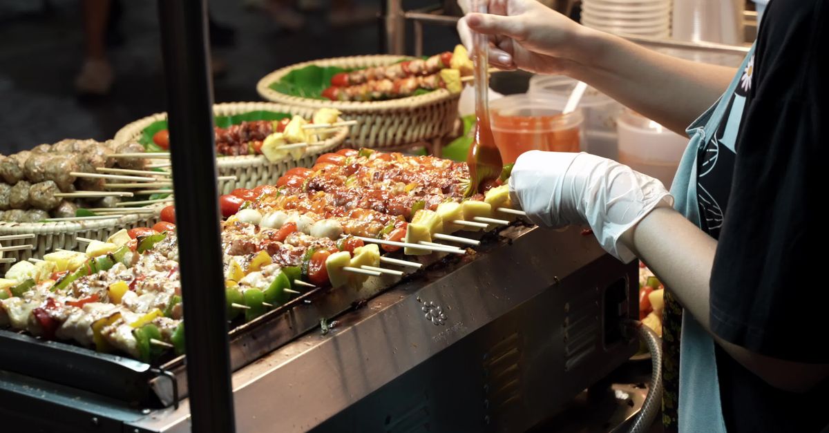 Vibrant Thai Street Food Skewer Grilling At Night Market Free Stock vibrant-thai-street-food-skewer-grilling-at-night-market-free-stock