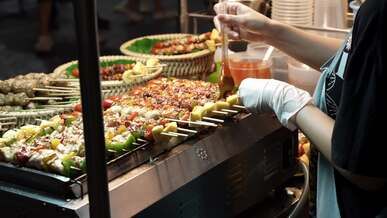 vibrant thai street food skewer grilling at night market