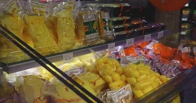 bright frozen food aisle in supermarket