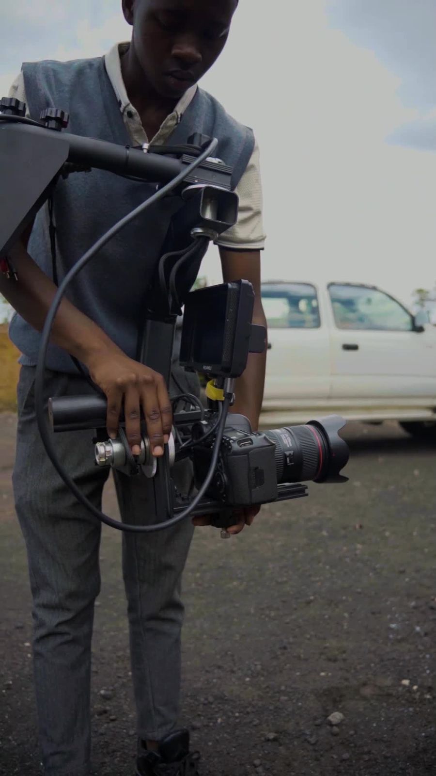 Videographer with a professional camera outdoors
