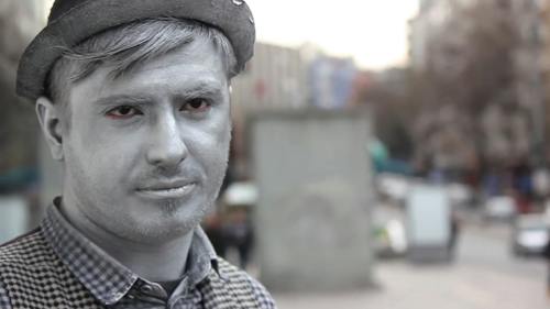 A Man Smoking In The Street