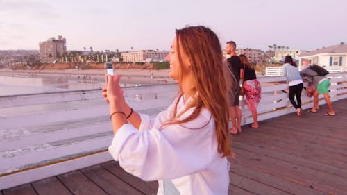 Couple Having A Picture Taken Overlooking The Sea