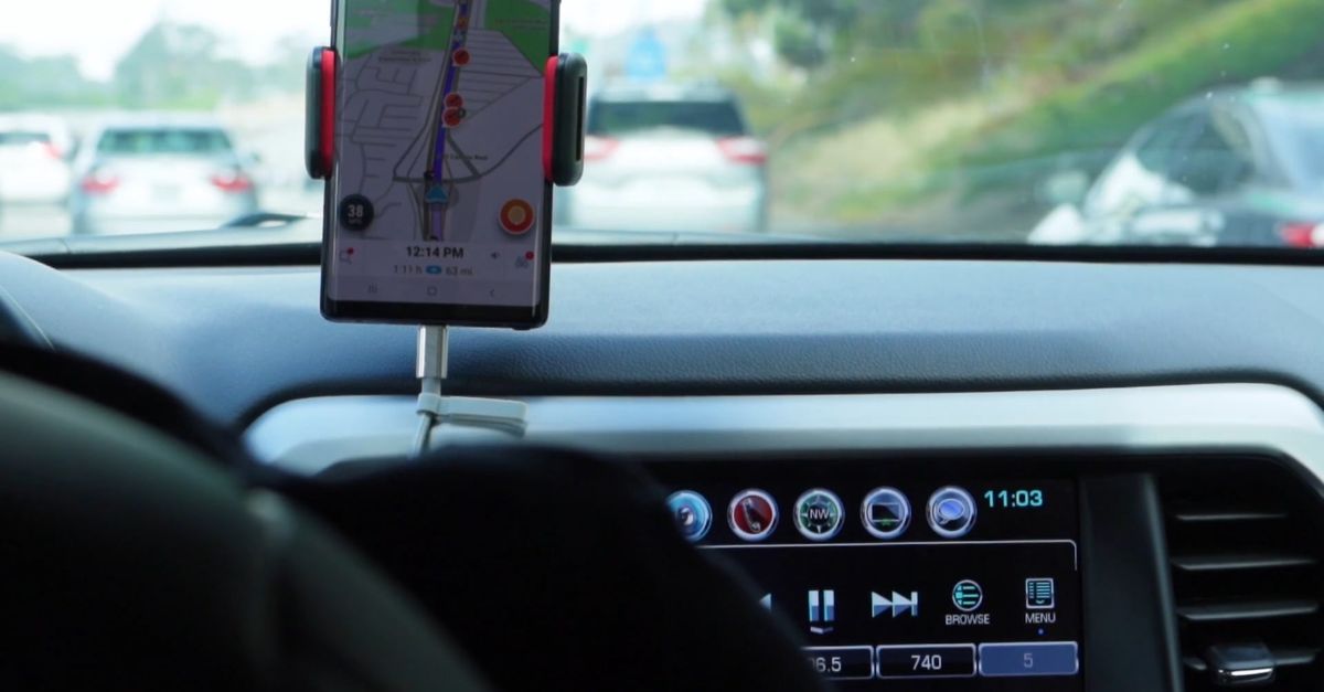 Driver Using. Map Driver Using Google Maps On The Cellphone Mounted On The Dashboard Free ...