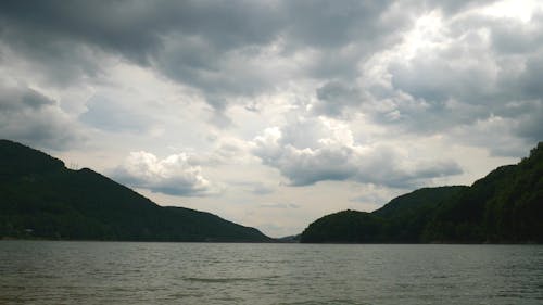 Body Of Water Under A Cloudy Sky