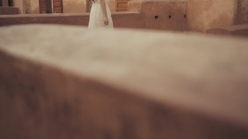 A Woman Wandering On An Ancient Building