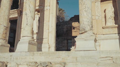 A Woman Walking Out From The Ancient Temple Ruins