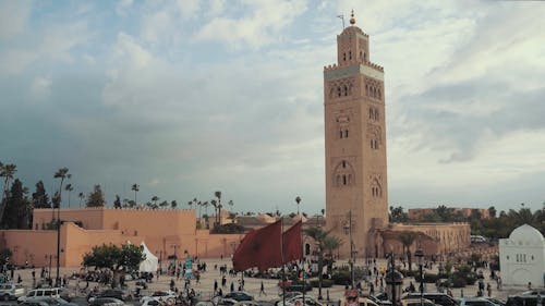 Time Lapse Footage Of A Busy Street In Front Of A Building With A Tower