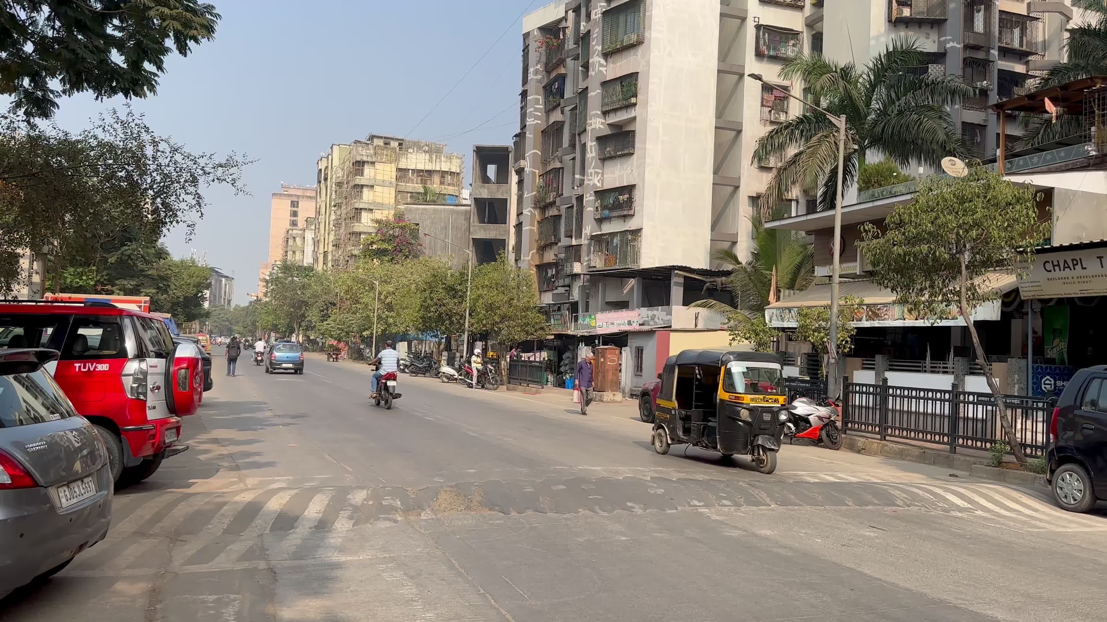 Busy Urban Street with Vehicles and Buildings Free Stock Video Footage ...