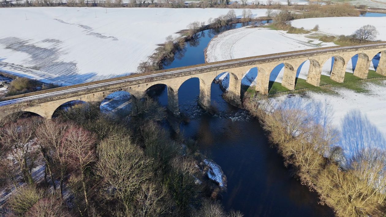 Stunning Winter Aerial of a Snowy Train Bridge Free Stock Video Footage ...