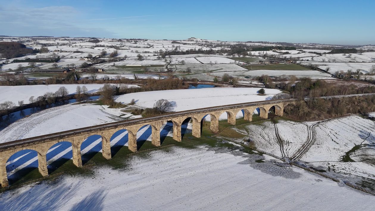 Aerial View of Snow-Covered Railway Viaduct Free Stock Video Footage ...