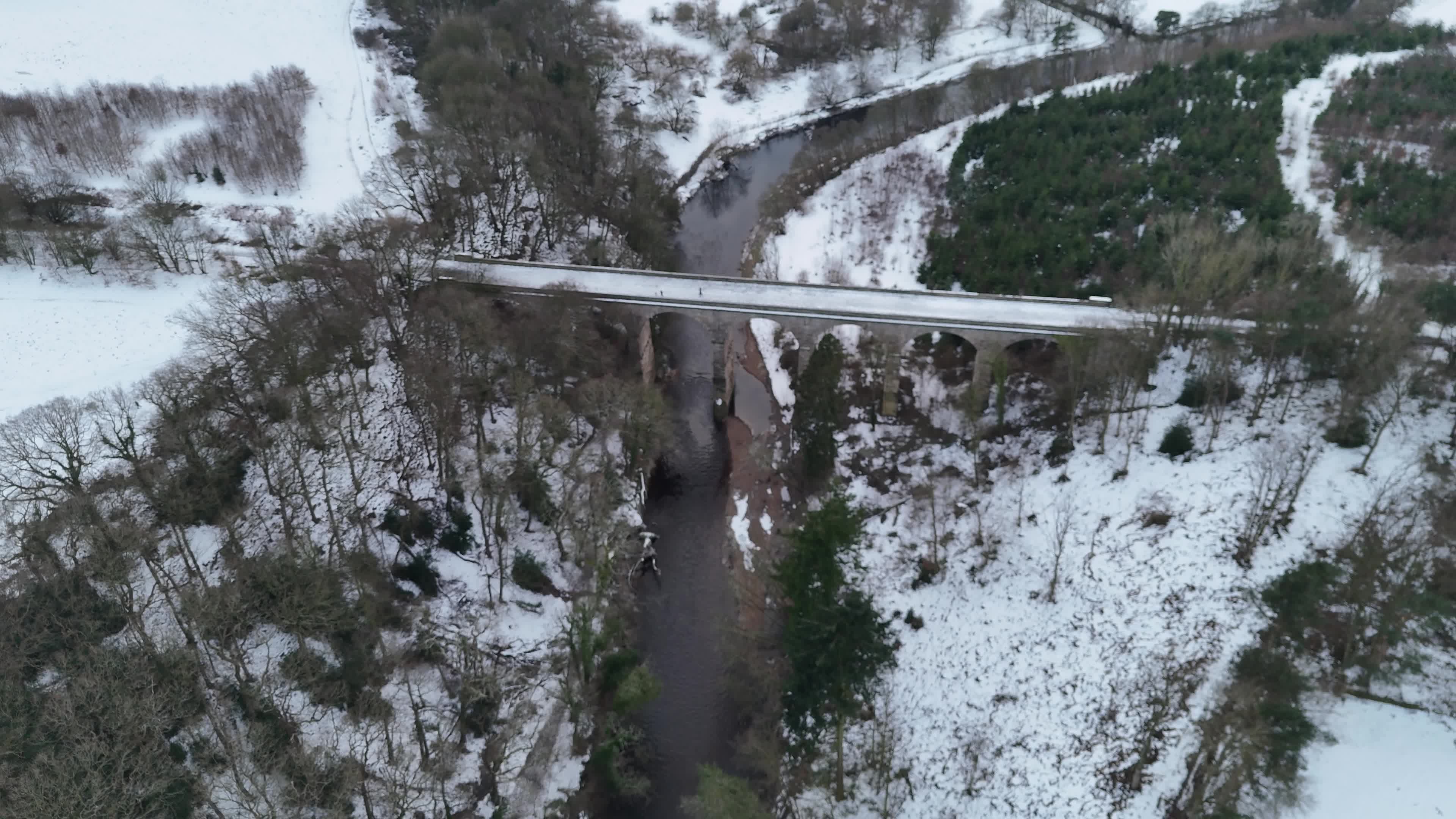 Aerial View of Snowy Bridge and River Winter Scene Free Stock Video ...