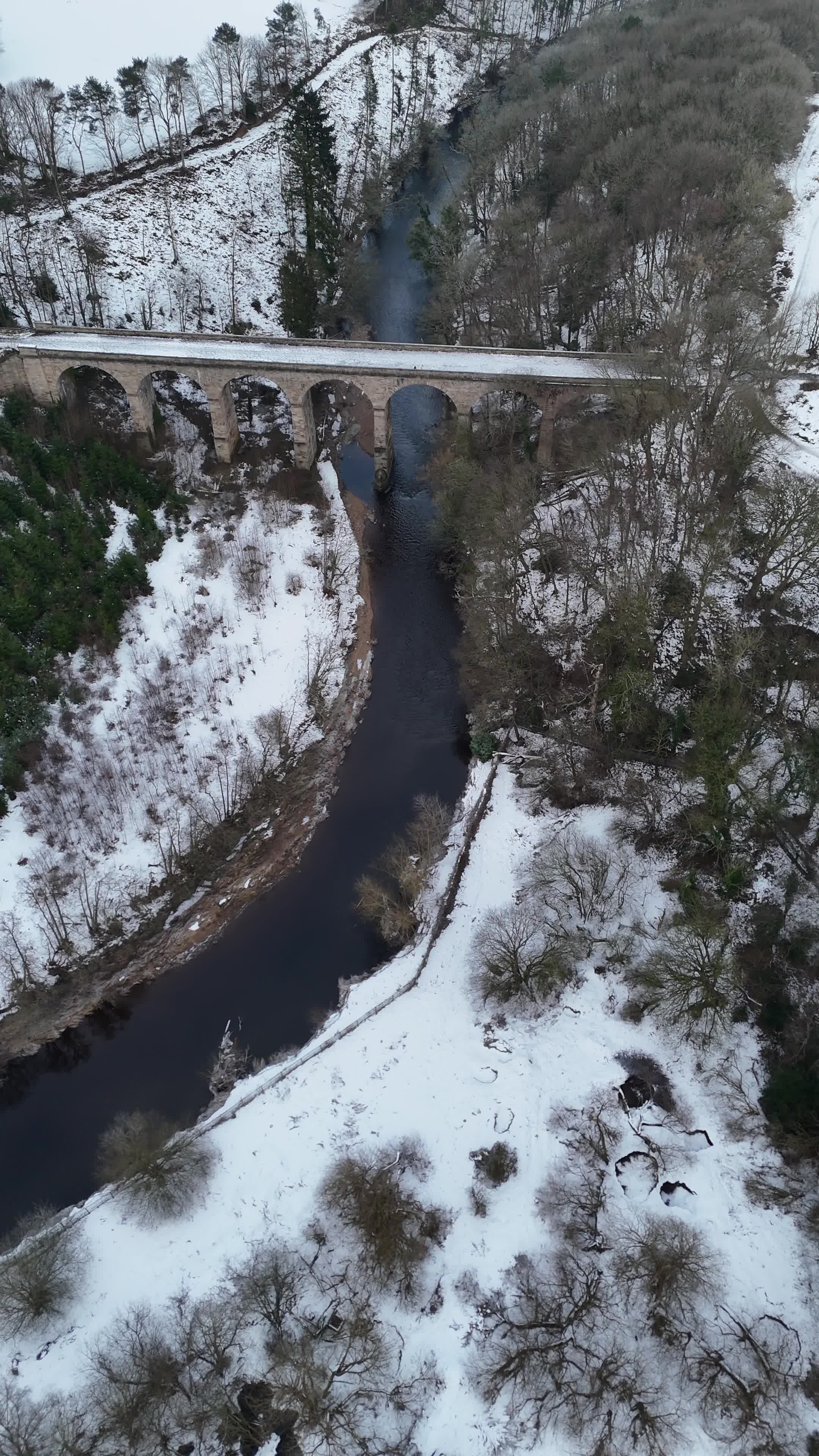 Aerial Snowy River Bridge in Scenic Winter Landscape Free Stock Video ...