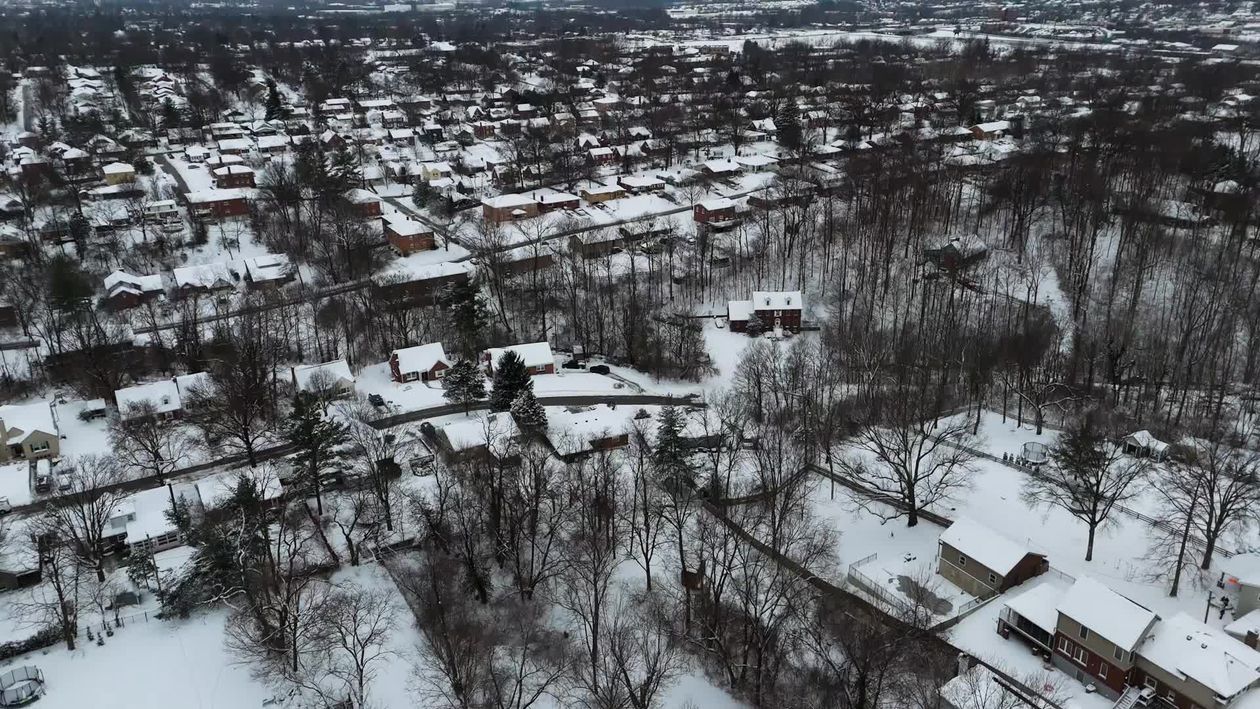 Aerial View of Snowy Suburban Neighborhood in Winter Free Stock Video ...