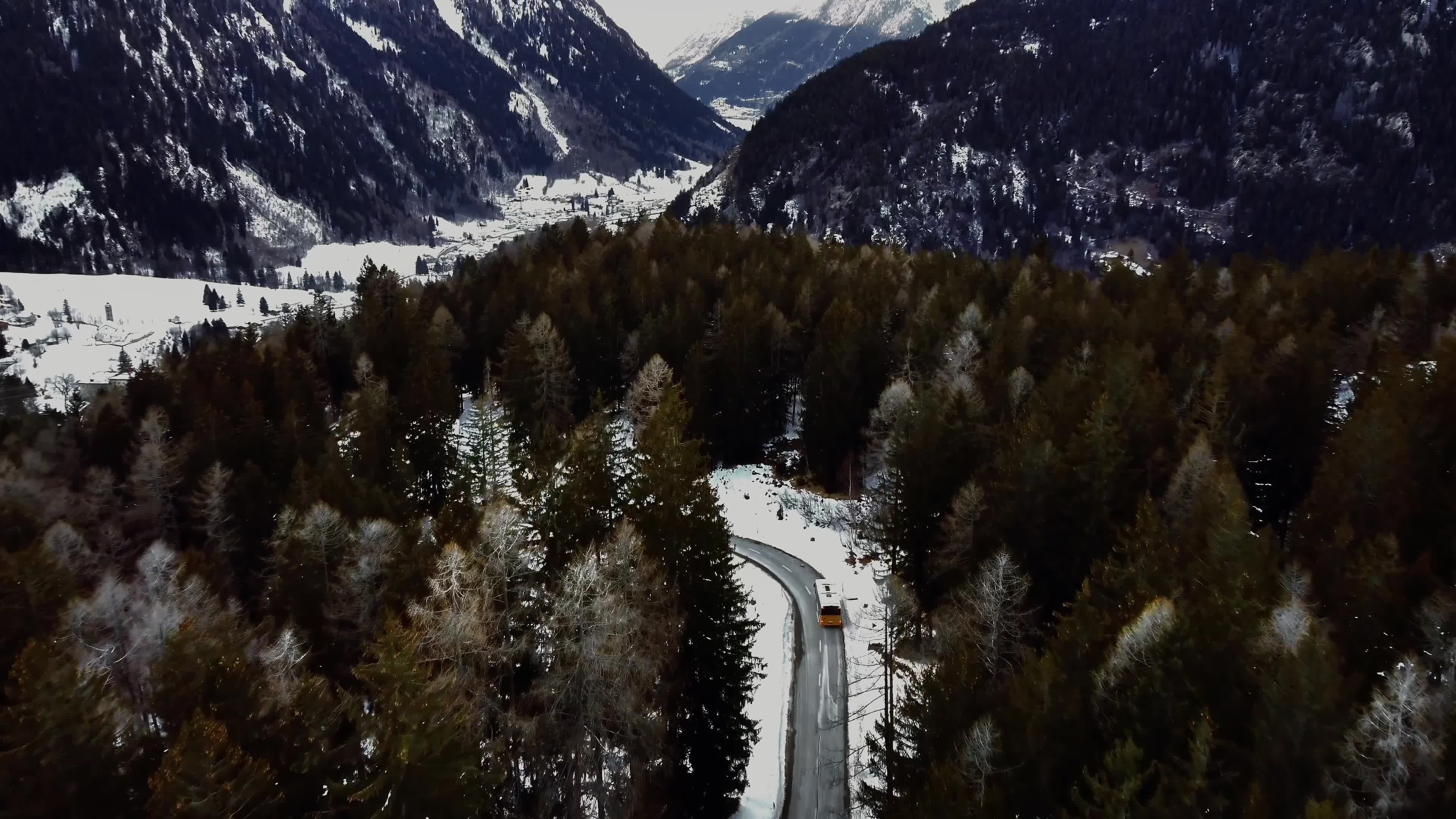 Aerial View of Snowy Forest and Winding Road Free Stock Video Footage ...