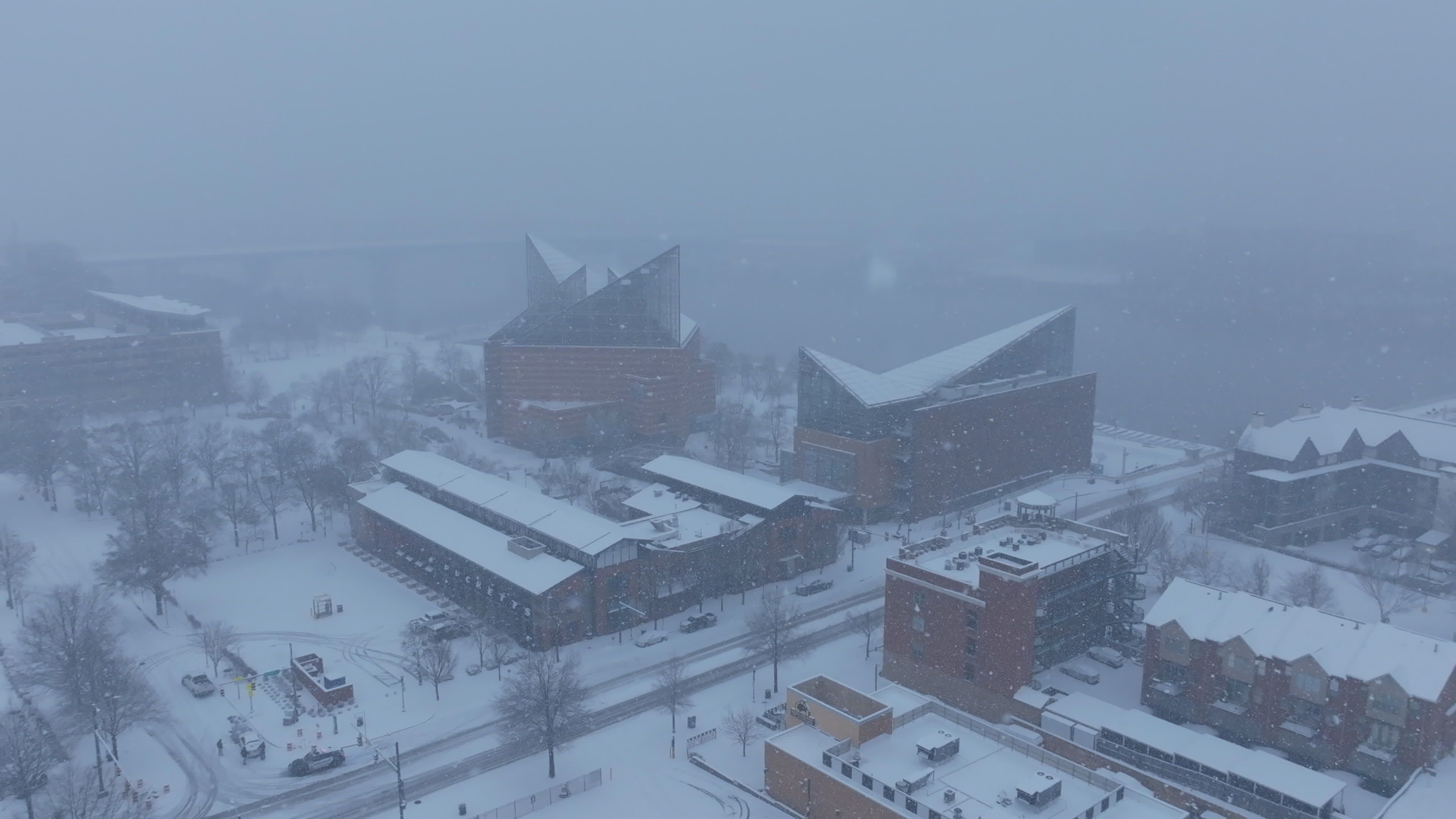 Aerial View of Snowy Urban Landscape in Winter Storm Free Stock Video ...