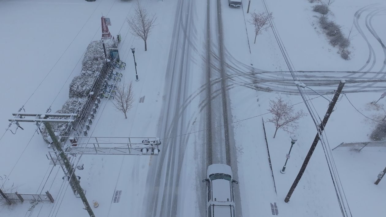 Aerial View of Snowy Urban Street in Winter Free Stock Video Footage ...