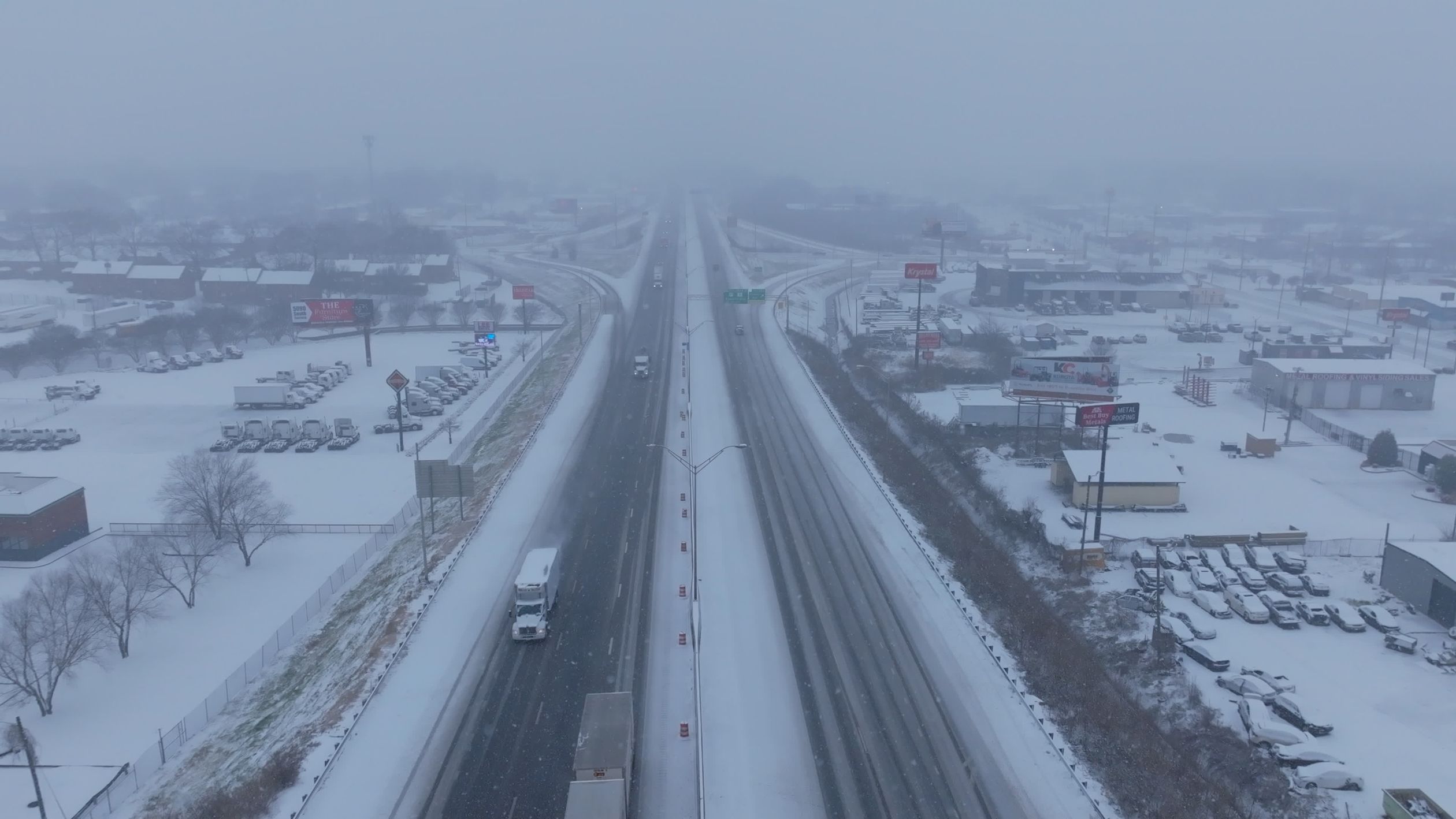 Aerial view of snowy highway during winter Free Stock Video Footage ...